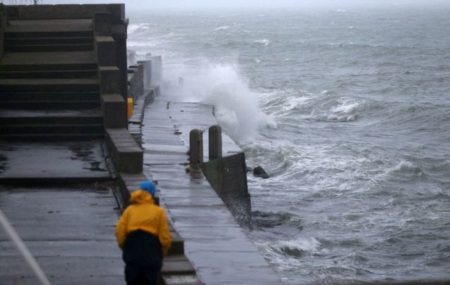 Waves crash against Dun Laoghaire Harbour, in Dublin, as Storm Lorenzo passes.