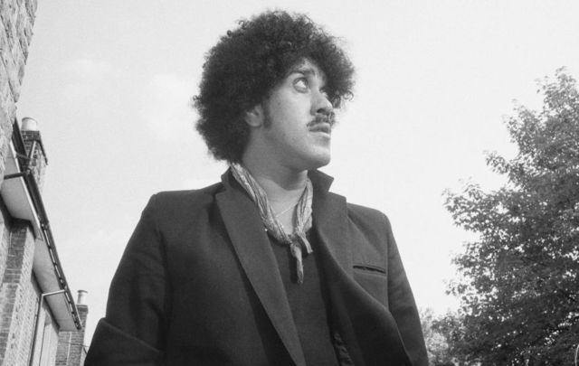 Phil Lynott, bass guitarist, and singer with Thin Lizzy posed in a London Street in August 1983. 