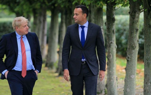 British Prime Minister Boris Johnson (L) walks with Ireland\'s Taoiseach Leo Varadkar (R) in the grounds of Thornton Manor Hotel near Birkenhead on October 10, 2019, in Liverpool, England.