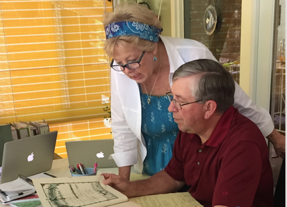 Kate and Mike Lancor searching through records.