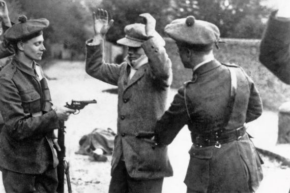 Members of the Black and Tans search an Irish citizen during the War of Independence. 