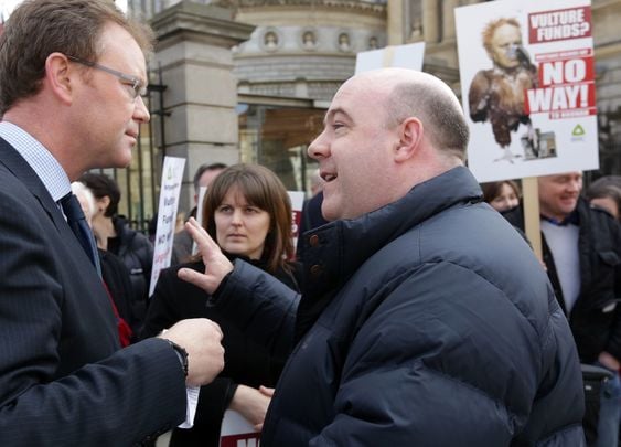 David Hall of the Irish Mortgage Holders Organisation (right) speaking to Labour Party\'s Arthur Spring, outside Ireland\'s government buildings during a 2014 protest over vulture funds.