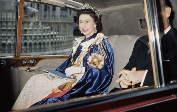 Queen Elizabeth II and Prince Philip attend a service for the Order of St Michael and St George at St Paul\'s Cathedral, London, 24th July 1968. The Queen is wearing the Star of the Order, which bears the motto \'Auspicium Melioris Aevi\'.