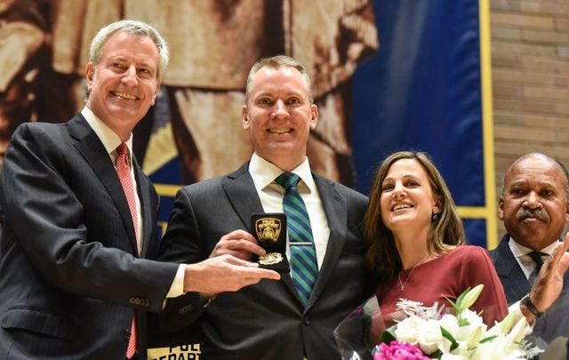 Dermot Shea (C) poses after being sworn in as the new NYPD Police Commissioner while standing next to the Bill de Blasio, Mayor of New York City, (L) on December 2, 2019, in New York City. Dermot Shea is the 44th commissioner of New York City following a three-year term of James P. O\'Neill.