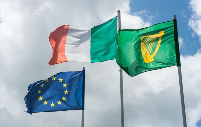 Irish and European flags blowing in the wind. 