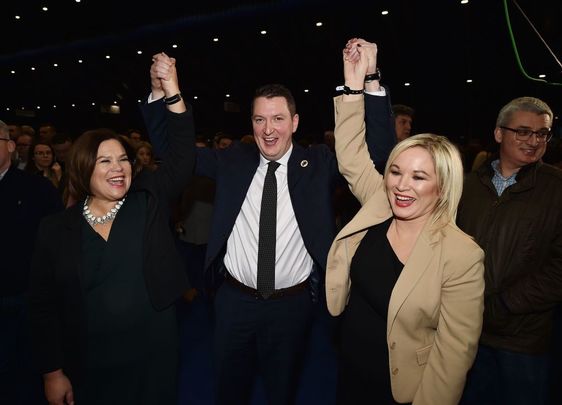 Sinn Féin candidate John Finucane celebrates his victory over DUP candidate Nigel Dodds alongside Sinn Fein President Mary Lou McDonald and Sinn Fein northern leader Michelle ONeill in the Belfast count center at the Titanic Exhibition center on December 13, 2019, in Belfast, United Kingdom.