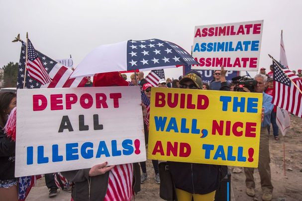 upporters of U.S. President Donald Trump rally for the president during his visit to see the controversial border wall prototypes on March 13, 2018, in San Diego, California. 