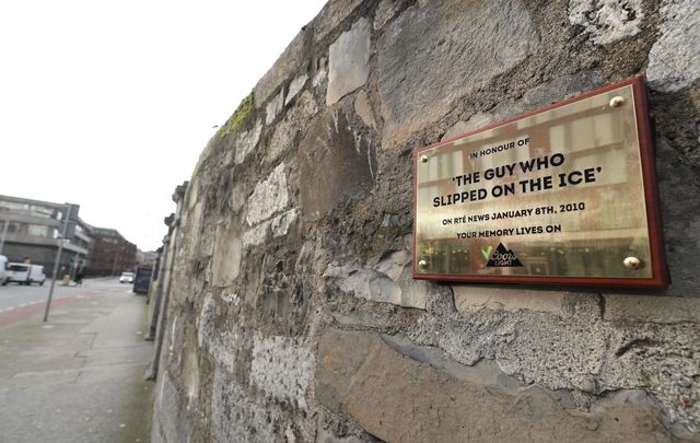 A plaque to remember \"The man who slipped on the ice.\" 