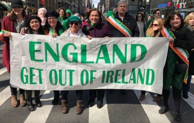 Mary Lou McDonald poses behind a United Ireland banner at the 2019 St Patrick\'s Day parade in New York.