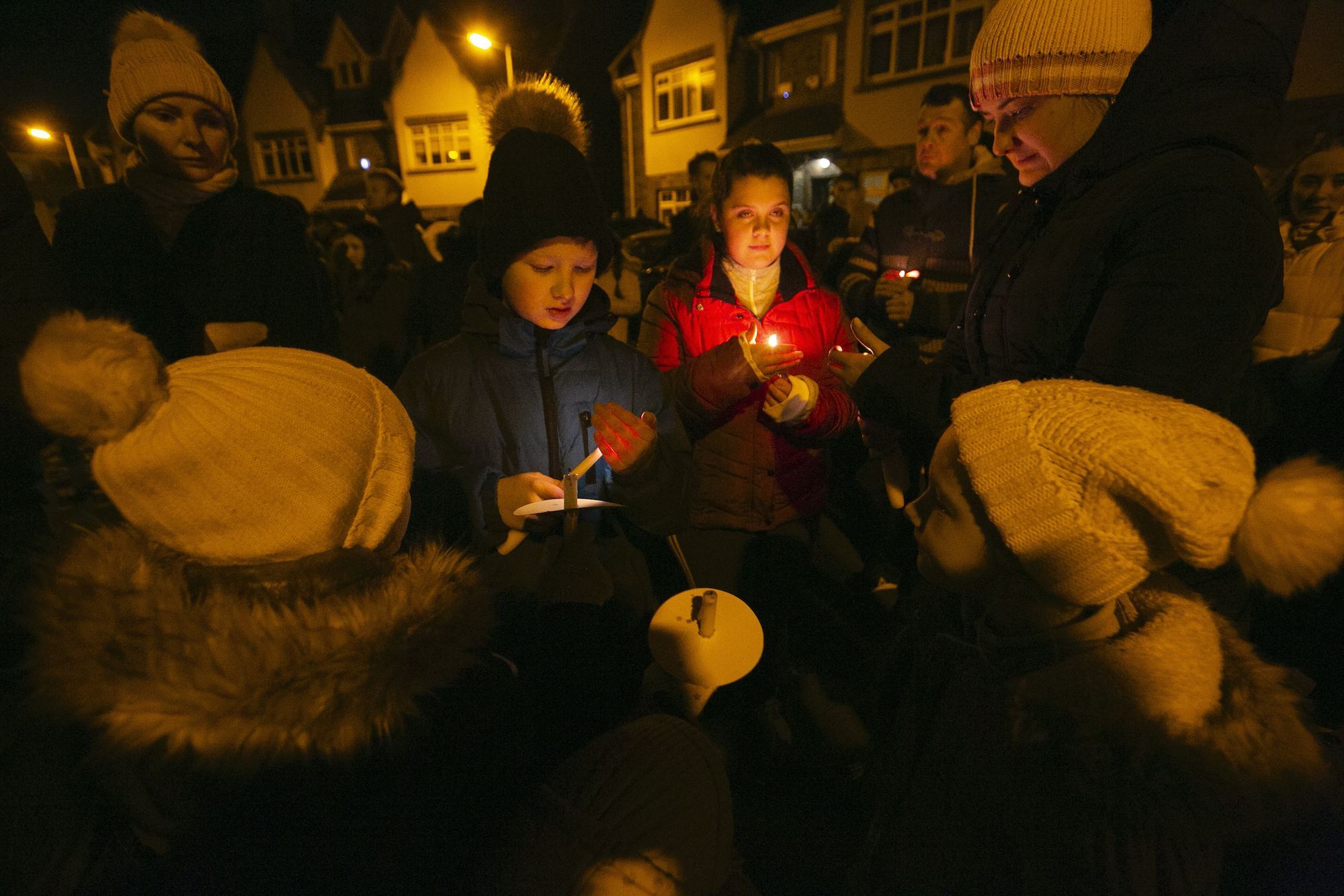Hundreds gather at candlelit vigil for murdered children as father speaks out