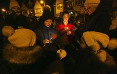 Hundreds gather at candlelit vigil for murdered children as father speaks out