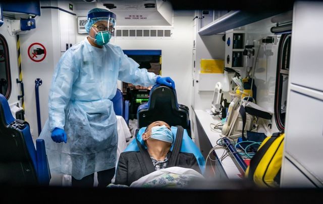 A doctor treats a patient for Coronavirus