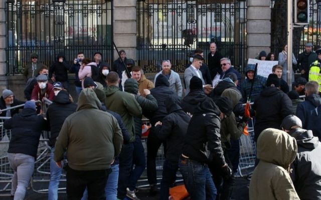 Counter-demonstrators attempt to confront far-right anti-mask protesters outside Government buildings in Dublin. 