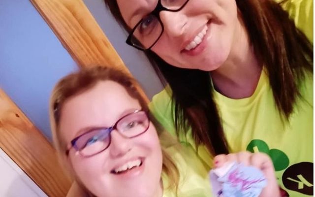 Lauren Devoy Carroll with proudly sports a Mini-Marathon participation medal with her mother Gillian. 