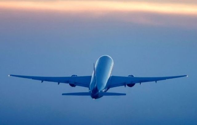 A total of 13 passengers on the flight tested positive for the coronavirus. 