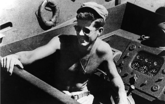 Naval Lieutenant and future President John F Kennedy on board the torpedo boat he commanded in the Southwest Pacific.
