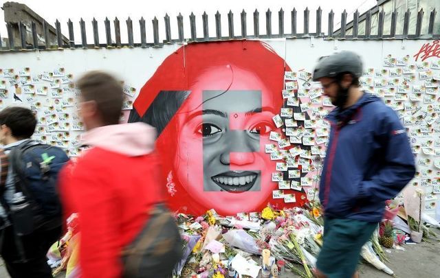 May 26, 2018: The mural of Savita Halappanavar by artist Aches on a white wall on Richmond Street South in Dublin city, on the eve of the Eighth Amendment referendum. As people began voting from early on Friday morning, flowers were left at the bottom of the mural, along with ‘Yes’ leaflets, pens, and sellotape so that people could leave notes.
