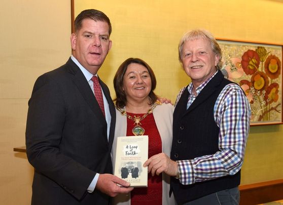 Golden years: At the 2019 Golden Bridges Conference in Boston, Mayor Marty Walsh (left) was presented with a copy of A Leap of Faith by Presbyterian peacemaker Rev David Latimer and Derry and Strabane Mayor Michaela Boyle. 