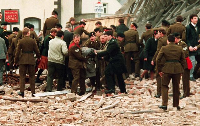 Members of the pubic and military deal with the aftermath of the 1987 Enniskillen, Remembrance Day, bombing which killed 11.