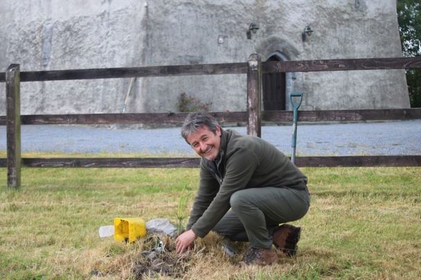 Naturalist and Filmmaker Colin Stafford Johnson plants an indigenous Scots Pine at Turin Castle Co Mayo