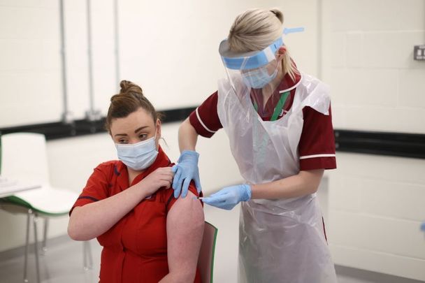 December 8, 2020: Joanna Sloan becomes the first person in Northern Ireland to receive the Pfizer / BioNTech coronavirus vaccine.