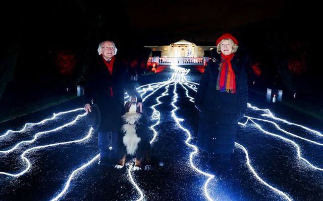President Higgins and his wife Sabina on December 10 after the Christmas lights were turned on at the Áras An Uachtaráin. The river of light is meant to represent the light that always shines for the global Irish family.