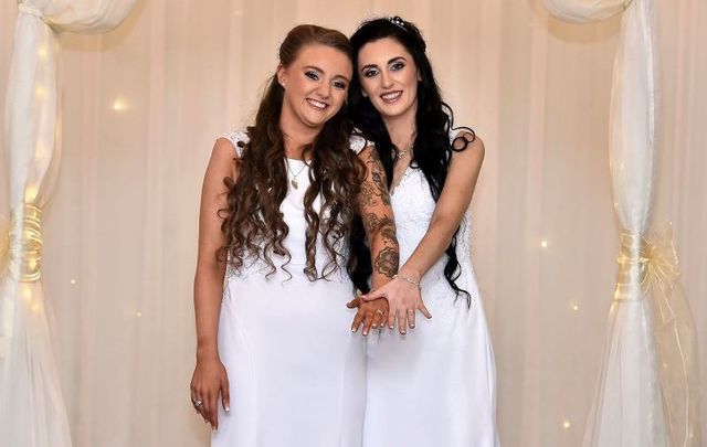Robyn Peoples (L) and Sharni Edwards after they became the first same-sex couple to legally get married in Northern Ireland.