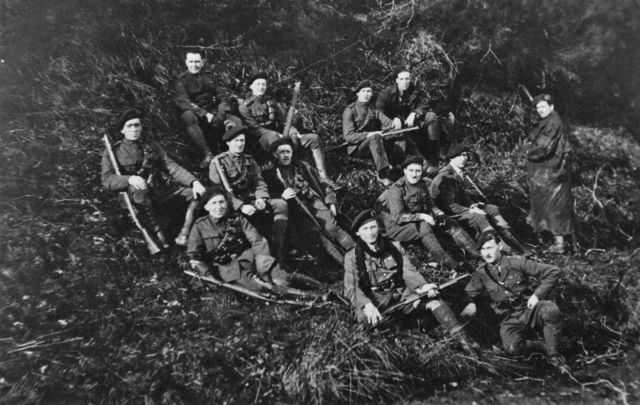 Men, possibly of the Royal Irish Constabulary (RIC) resting in the hills of Tipperary, Ireland, during the Irish War of Independence, 1921. 