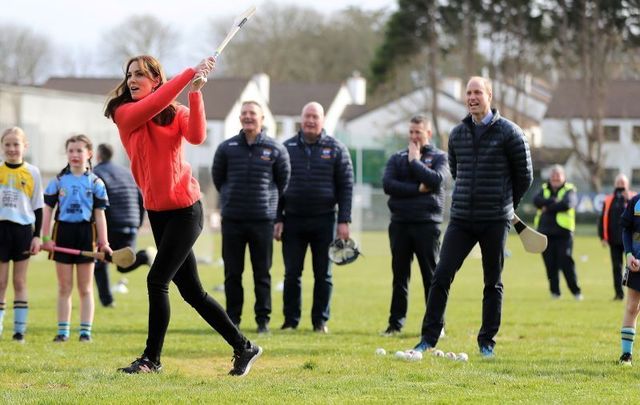 Kate Middleton tries her hand at hurling as Prince William watches on in Co Galway.