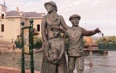 How did Annie Moore become the first person through Ellis Island?