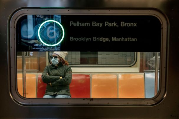 A masked New Yorker on the subway.