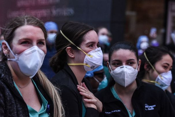 New York healthcare workers take a break during the COVID-19 pandemic.