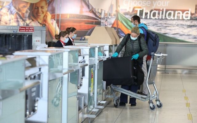 Passengers at an almost deserted Dublin Airport, where foreign travel is almost non-existent. 