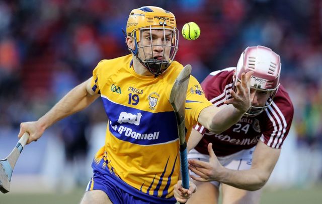 Shane O\'Donnell of Clare runs past Padraig Breheny of Galway during the 2017 AIG Fenway Hurling Classic and Irish Festival at Fenway Park on November 19, 2017.