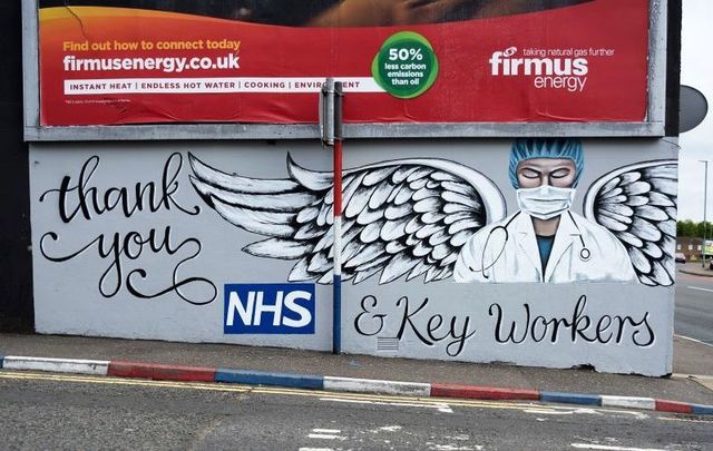 A repurposed former loyalist mural expresses support for the NHS in the Waterside on May 18, 2020, in Derry, Northern Ireland. 