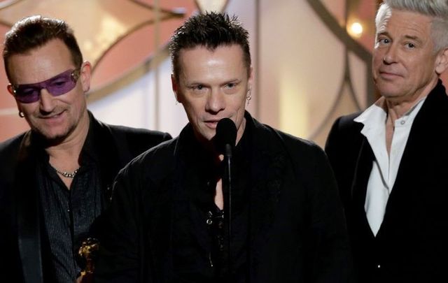 Larry Mullen, Jr accepting the award for Best Original Song - Motion Picture for \"Ordinary Love\" by U2 from \"Mandela: Long Walk to Freedom\" during the 71st Annual Golden Globe Awards.