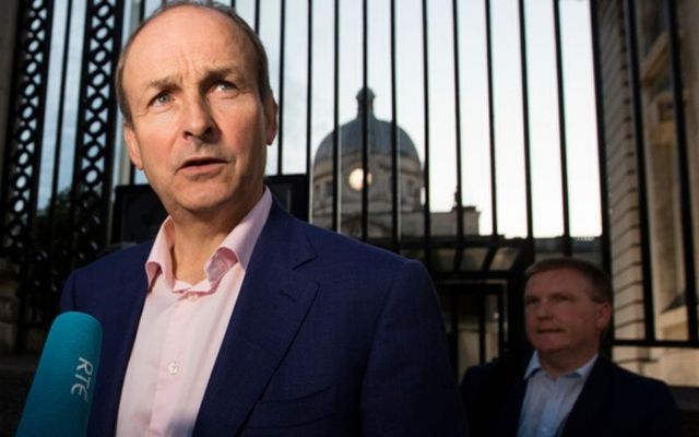 Michéal Martin arrives at government buildings with his team to finalize a deal on a coalition government. 