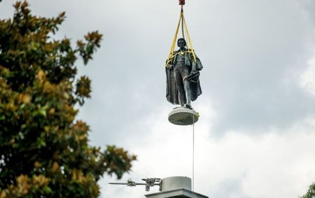 Workers remove the statue of Irish American Vice President John Calhoun in South Carolina. 