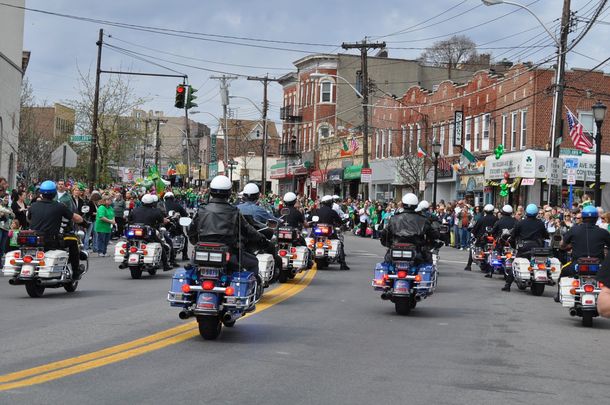 The Yonkers Police Department riding in the Yonkers St. Patrick\'s Day Parade on McLean Avenue.