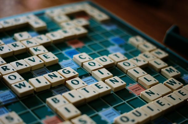 The North American Scrabble Players Association is considering banning more than 200 slurs.