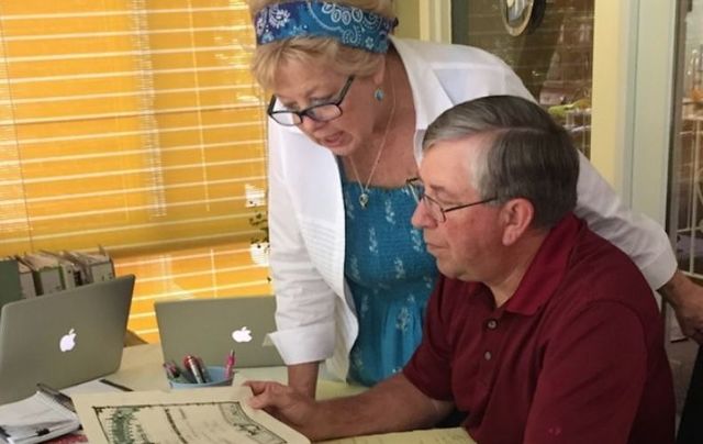 Kate and Mike reviewing family records in the Kennedy family bible passed down through four generations. Like other members of the Irish American diaspora, strong bonds exist between their family members and the people of Ireland.