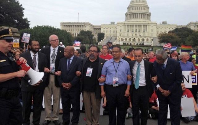 Joe Crowley (third from left) and John Lewis arm in arm on October 8th, 2013 in Washington, DC for the Camino Americano: March for Dignity and Respect.