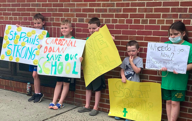 Children protest outside St. Paul the Apostle School in Yonkers.