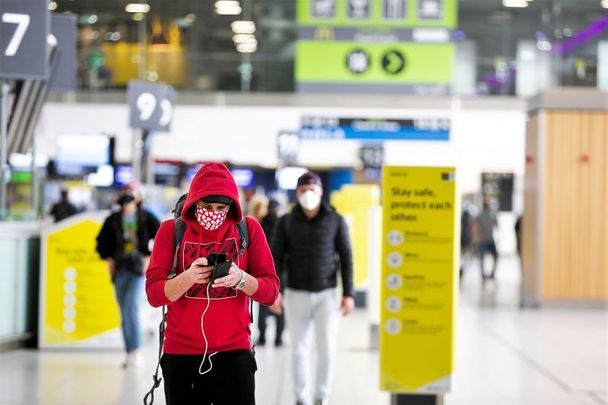 A passenger at Dublin Airport, which now has COVID guidance signs throughout.