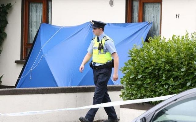 A member of An Garda Síochána patrols Whitechapel Road, where the 77-year-old was brutally stabbed to death. 