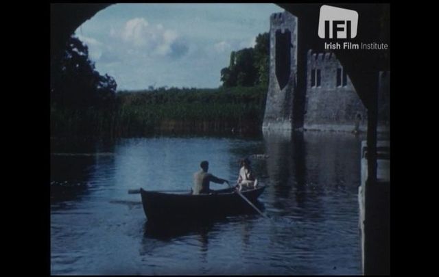 A man and a woman outside of Ashford Castle in Co Mayo in 1946, as featured in Desmond Egan\'s \"By Corrib Waters\"