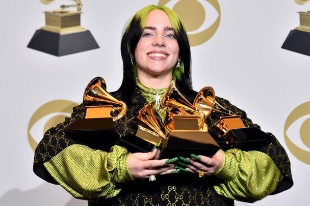 Billie Eilish photographed with her five Grammy awards at the 2020 ceremony. 