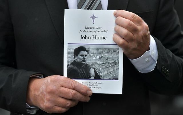 August 5, 2020: A mourner holds an order of service as the funeral takes place for John Hume at St Eugene\'s Cathedral in Derry.