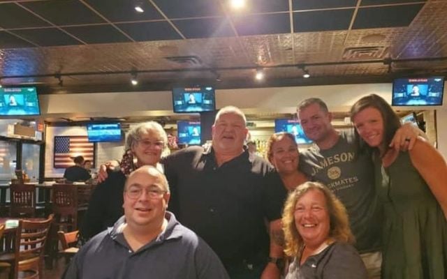 Danny Price (center-left in the back row) after meeting his long-lost family. 