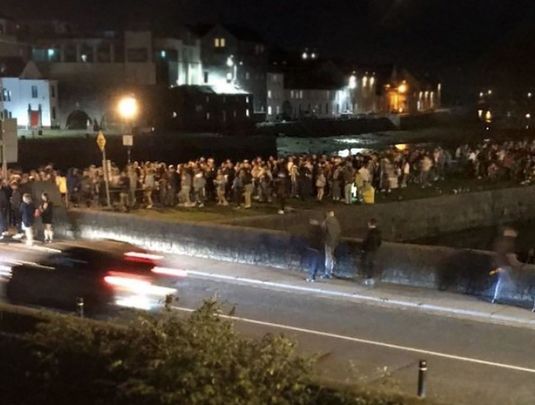 Students gathered on Tuesday night at the Spanish Arch, in Galway city center.